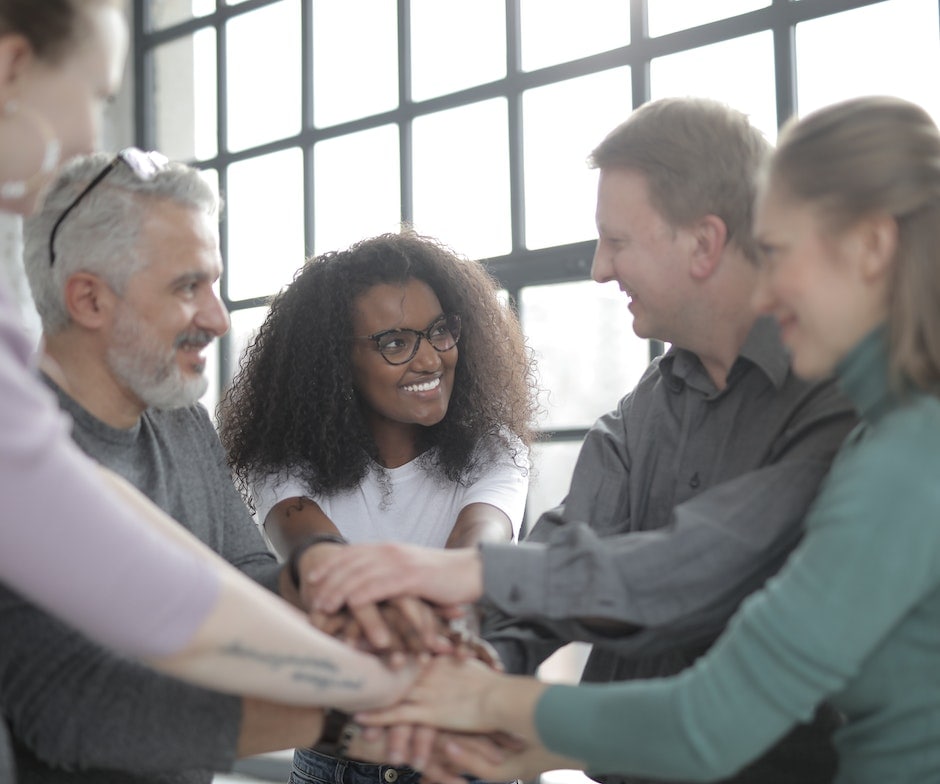 people in a group, smiling to each other