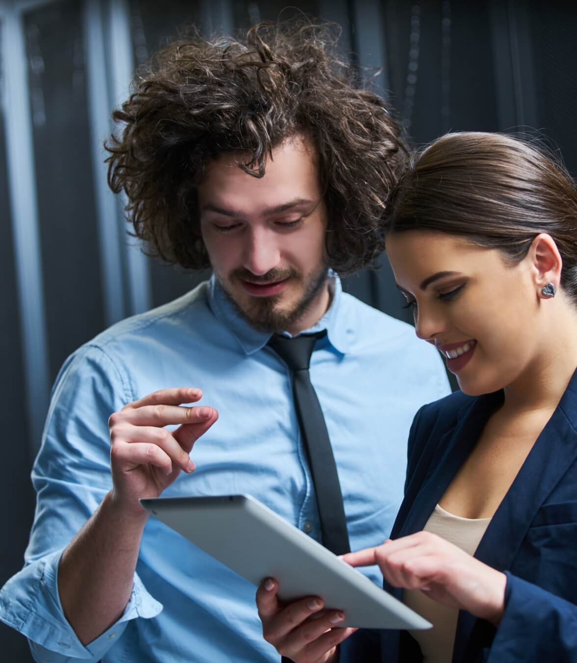 Two people discussing by looking into the Tab