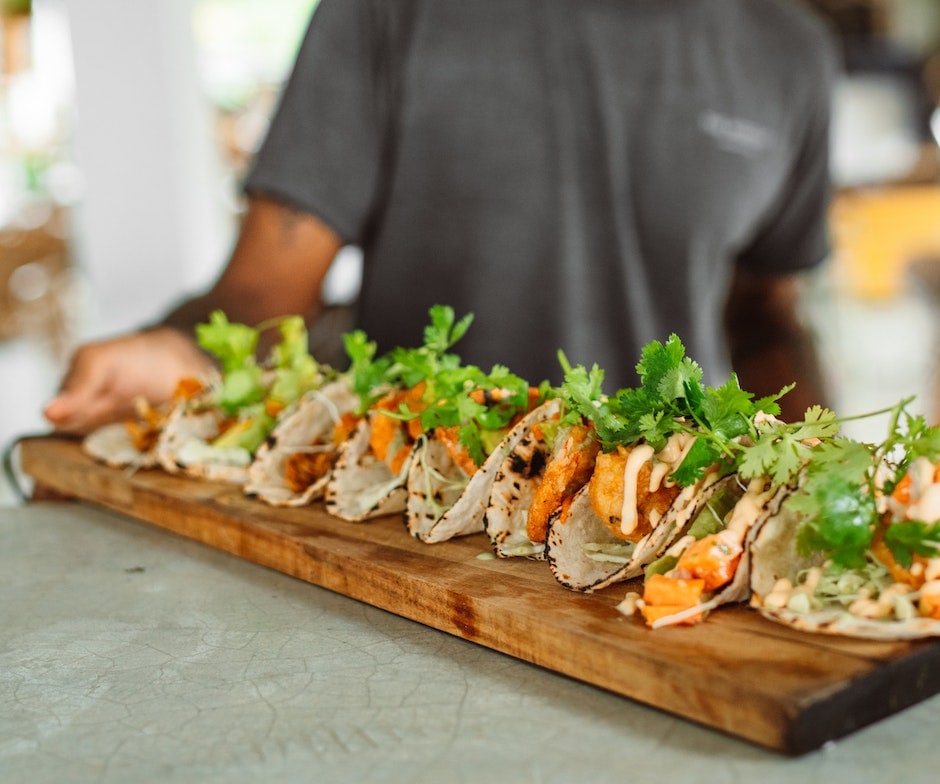 Man serving tacos