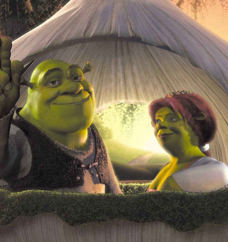 Shrek and Fiona seated in an onion carriage