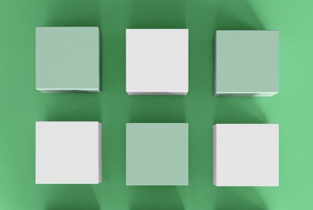 Cubi bianchi e verdi su uno sfondo verde