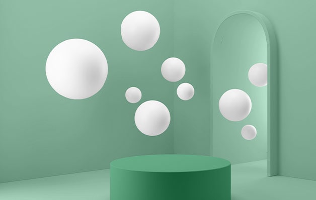 floating white spheres with a green cylinder on the ground in a green room