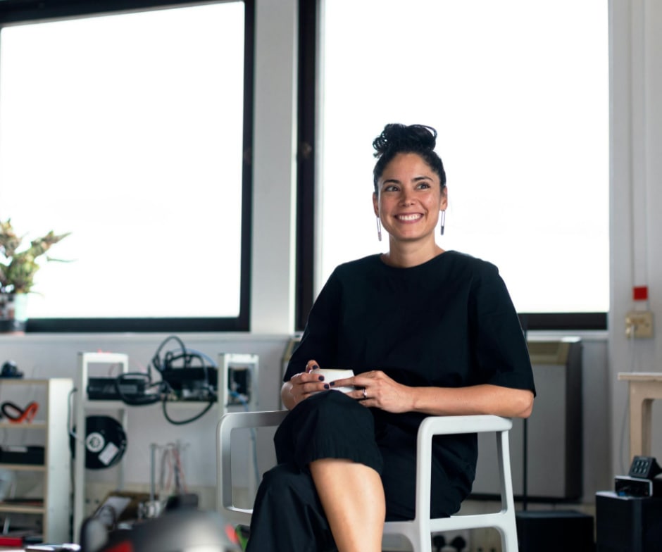 A Person sitting posing to camera