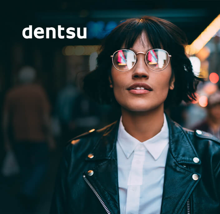 dentsu logo and person with glasses