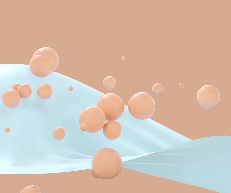 peach colored balls falling on white ribbonlike object