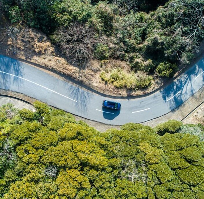 arial view of car on curve in road