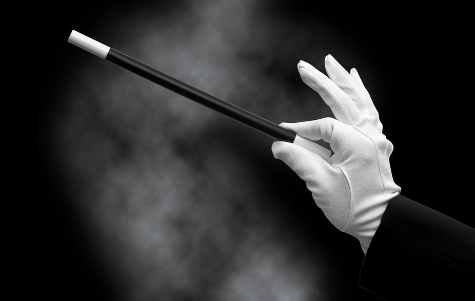 Person holding magic wand