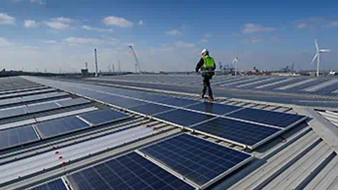 A Person walking on solar panels
