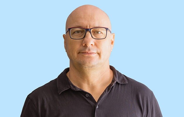 man with black shirt and glasses