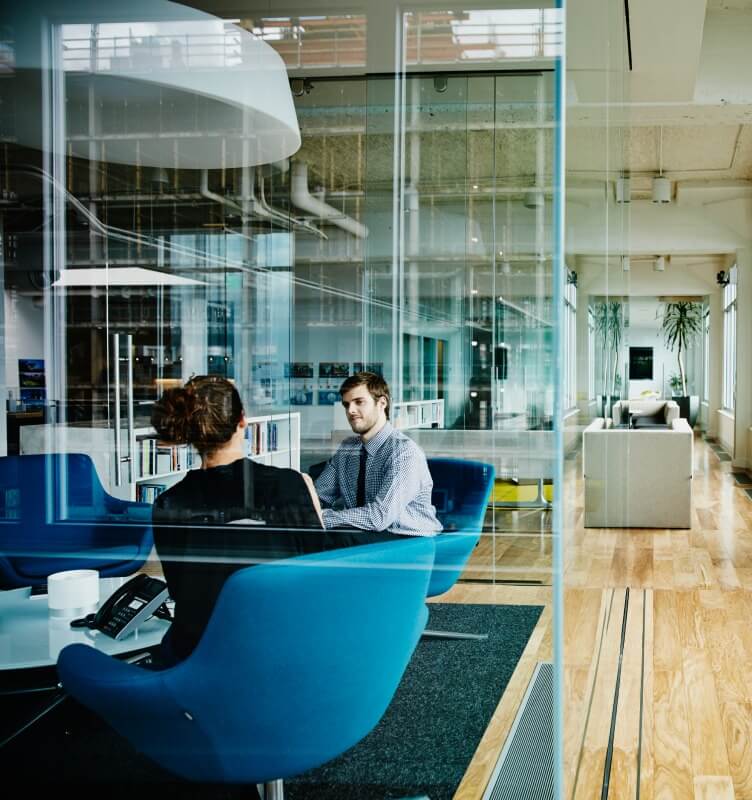 Employees conversing in an office