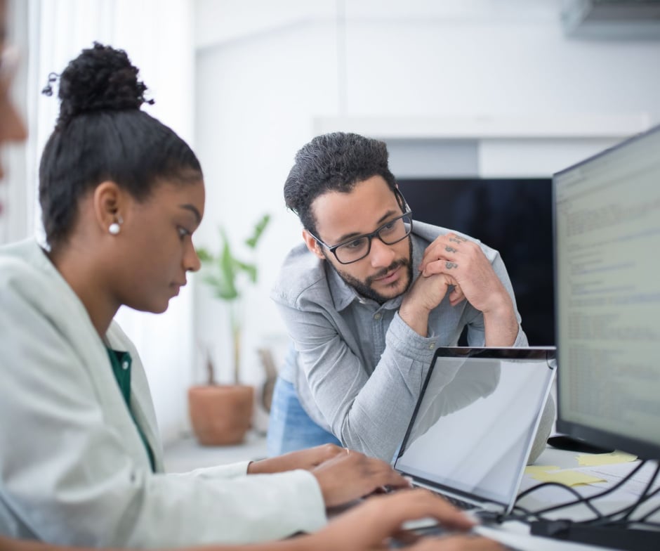 People looking at a computer screen together