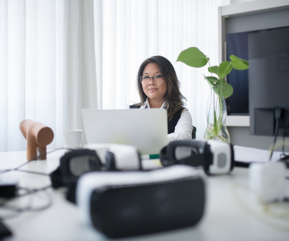 A Person sitting at office and posing to camera
