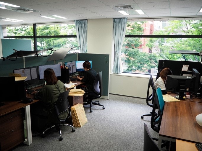 People working in an office with computer