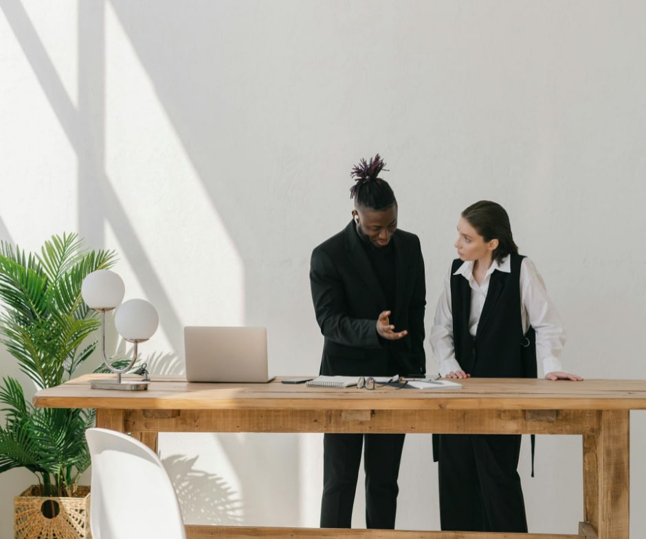 people talking at desk