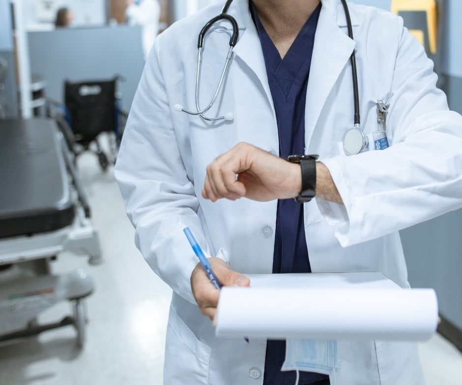 Doctor looking at their watch